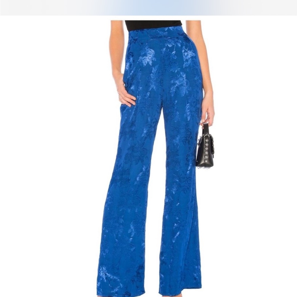 Majorelle revolve blue satin pants with floral pattern